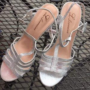 I am selling silver rhinestoned heels size 7.